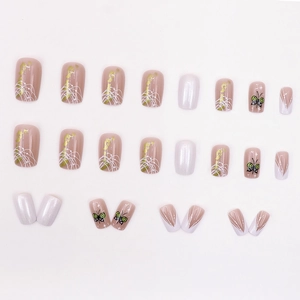 Elegant aurora gold foil press-on nails with butterfly patterns and french design
