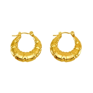 Classic gold twisted shrimp hoop earrings with polished metal finish on white background