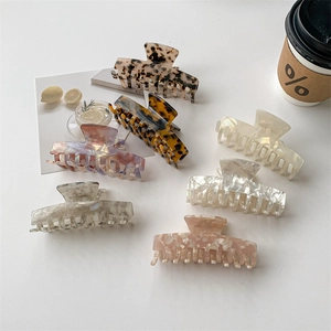 Set of six assorted acetate hair claws with vintage mermaid colors and marble patterns