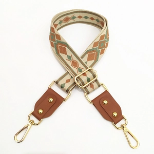 Ethnic jacquard woven strap with adjustable leather ends and golden lobster clasps
