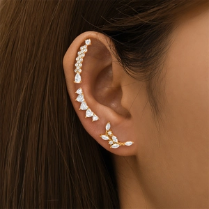 Detailed view of S925 silver butterfly and heart zircon stud earrings worn on the ear