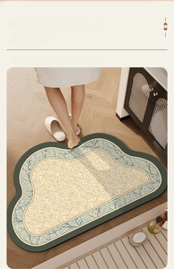 Detail of green floral bath mat on wooden floor with vintage pattern for bathroom