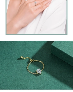 Macro detail of teardrop diamond chain ring with adjustable bead clasp in gold plating