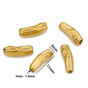 Detailed view of 11mm irregular curved gold spacer beads with 1.6mm hole size dimensions