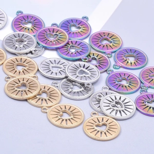 Polished stainless steel heart charm pendants in gold, silver, and rainbow finishes