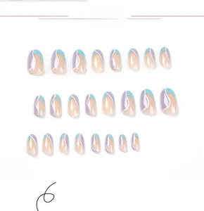 Detailed view of oval press-on nails with purple and blue wavy patchwork design