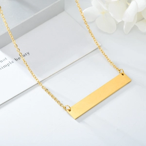 Minimalist gold bar necklace with a sleek stainless steel rectangular pendant on a fine chain