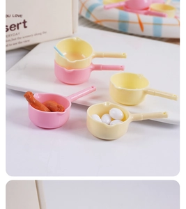 Miniature pink and yellow kitchen toy pots with faux food for dollhouse accessories