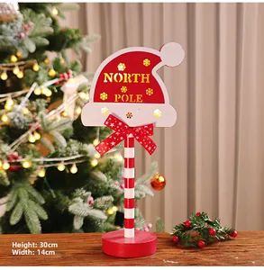 Detailed view of North Pole Christmas wooden sign with dimensions 30cm by 14cm