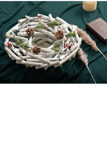 Macro detail of white Nordic wooden candle holder with pine cones and red berries decor