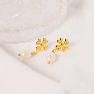 Fashionable gold clover drop earrings with white pearl pendants for a stylish look