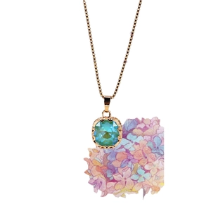 Square cut teal gemstone pendant with gold box chain and watercolor hydrangea backdrop
