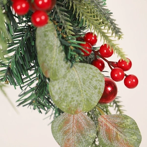 Christmas hanging decor with red berries, green pine needles and eucalyptus leaves