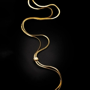 Minimalist gold snake chain long necklace with adjustable square slide buckle on black background