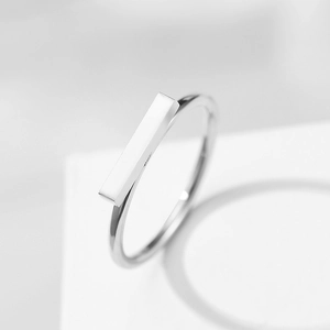 Minimalist silver stainless steel geometric bar ring with a sleek polished finish