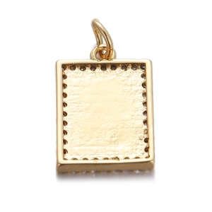 Detailed view of square gold plated MAMA pendant with textured surface and beaded edge