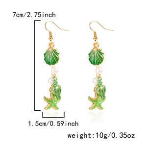 Detail showing conch and starfish earrings with dimensions 7cm height and 1.5cm width