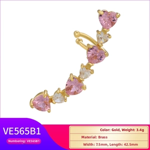 Macro detail of gold-plated heart ear cuff with pink and clear zircon inlays