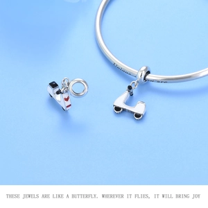 Detail of S925 sterling silver motorcycle charm with Unique you are engraving on bracelet