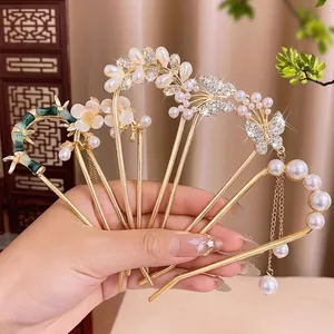 Élégant ensemble de pics à cheveux dorés avec papillons, perles et motif de bambou vert