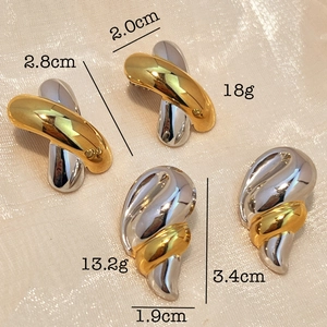 Minimalist stainless steel teardrop earrings in mixed gold and silver tones with glossy finish