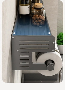 Detail view of double-layer grey kitchen rack for spice jars and paper towel roll