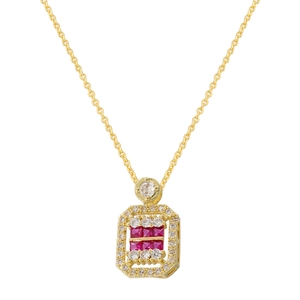 Detailed macro of gold cubic pendant necklace with inlaid red and white crystals
