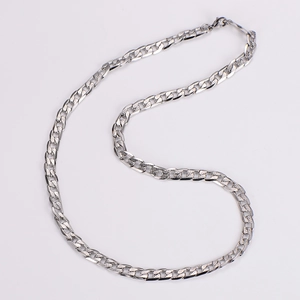 Detailed close-up of polished silver Cuban link chain with lobster clasp on white background