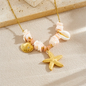 Golden starfish and shell necklace with natural beads on a beach-themed background