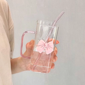 Square clear glass cup with pink handle, pink bow decoration and matching glass straw