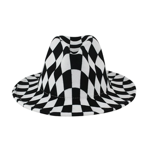 Close-up of black and white checkerboard pattern on the brim of a wool fedora hat