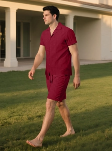 Detail of burgundy waffle knit short sleeve shirt and drawstring shorts for summer leisure