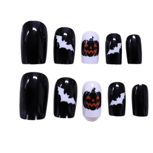 Halloween press-on nails with black and white bat and orange pumpkin designs