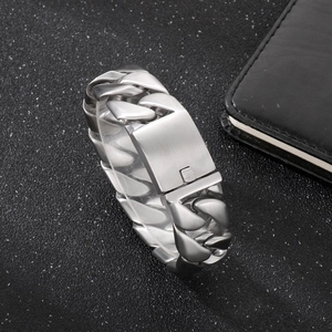 Mens silver titanium steel Cuban link bracelet with brushed metal finish on black background