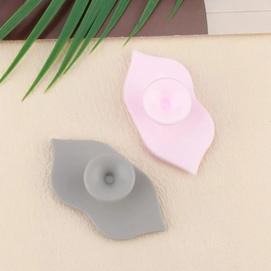Silicone lip exfoliating brush set in pink and grey with suction cup base and soft bristles