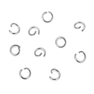 Assorted stainless steel open jump rings for DIY jewelry making on white background