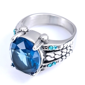 Vintage stainless steel ring for men featuring a deep blue gemstone and engraved patterns