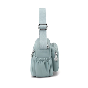 Light blue nylon crossbody bag with side zipper pocket and adjustable strap view