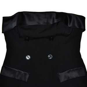 Detail of black strapless mini dress featuring double-breasted buttons and satin trim pockets