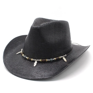 Classic black woven western cowboy hat with wide brim and bohemian feather accessory