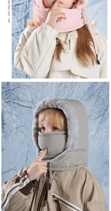 Close-up of windproof winter hat with warm faux fur lining and integrated face mask