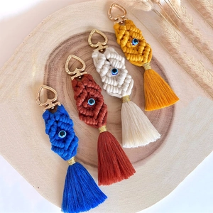 Set of four handmade bohemian macrame tassel keychains with evil eye beads and metal clips