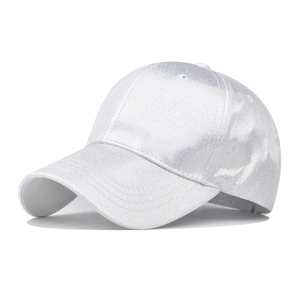 Close-up of shiny white PU baseball cap with glitter finish and curved brim