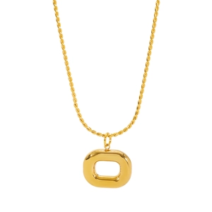 Detailed macro view of 18K gold plated hollow geometric pendant and twisted rope chain