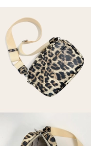 Close-up of leopard print crossbody bag featuring adjustable strap and metal zipper