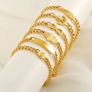 Women Gold Cuban Link Bracelet Stainless Steel 18K Gold Plated Fashion Jewelry Featuring Wing Anchor Infinity Charms
