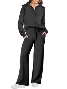 Women's black lounge set with half-zip hoodie and high-waisted wide-leg trousers