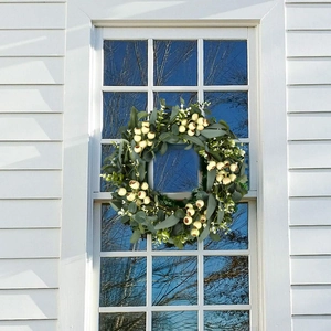 Artificial eucalyptus wreath with white berries for front door and wall decoration