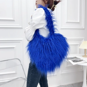 Furry heart-shaped tote bag in Klein blue plush faux fur, stylish oversized shoulder bag