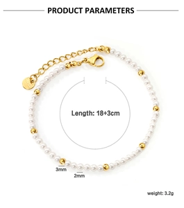 Detail view of double-layer stainless steel bracelet with white shell and gold beads